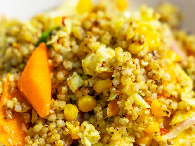 Babali signature millet dish with fresh vegetables and herbs